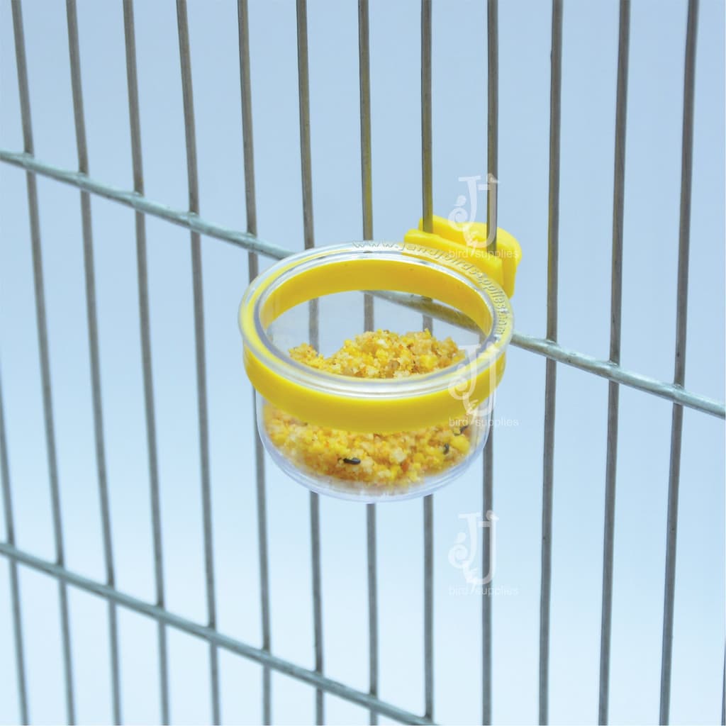 For Soft Food, Grit and Minerals
 ideal for budgies, finches and love birds. It is a long clear plastic drawer that holds a lot of sufficient food for your birds. Doesn’t take much